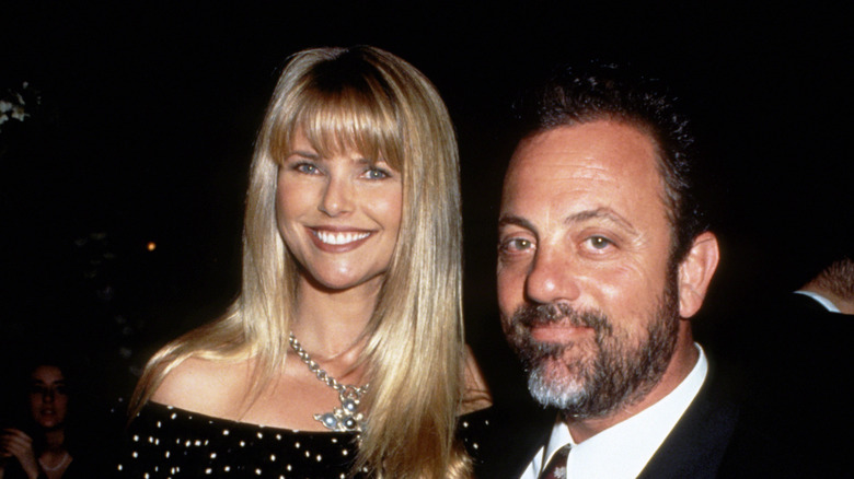 Christie Brinkley and Billy Joel smiling.