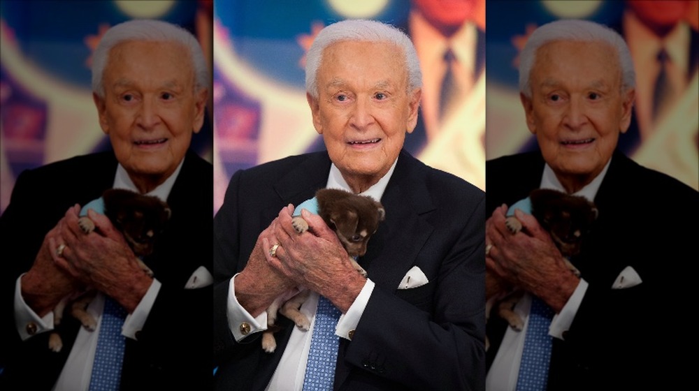 Bob Barker holding puppy