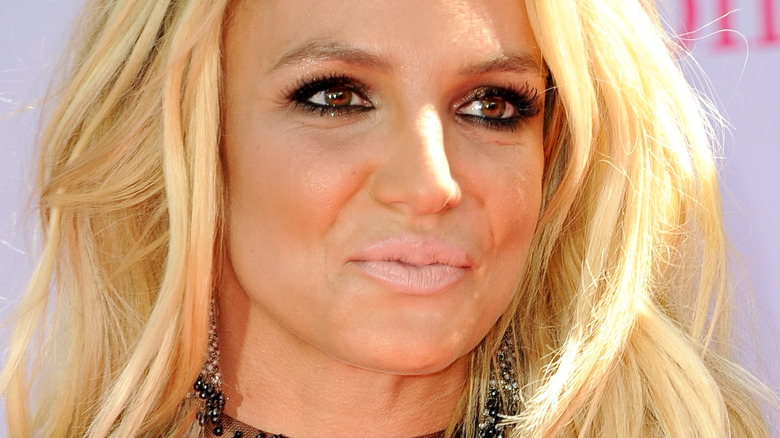 Britney Spears looking to the side with light lipstick