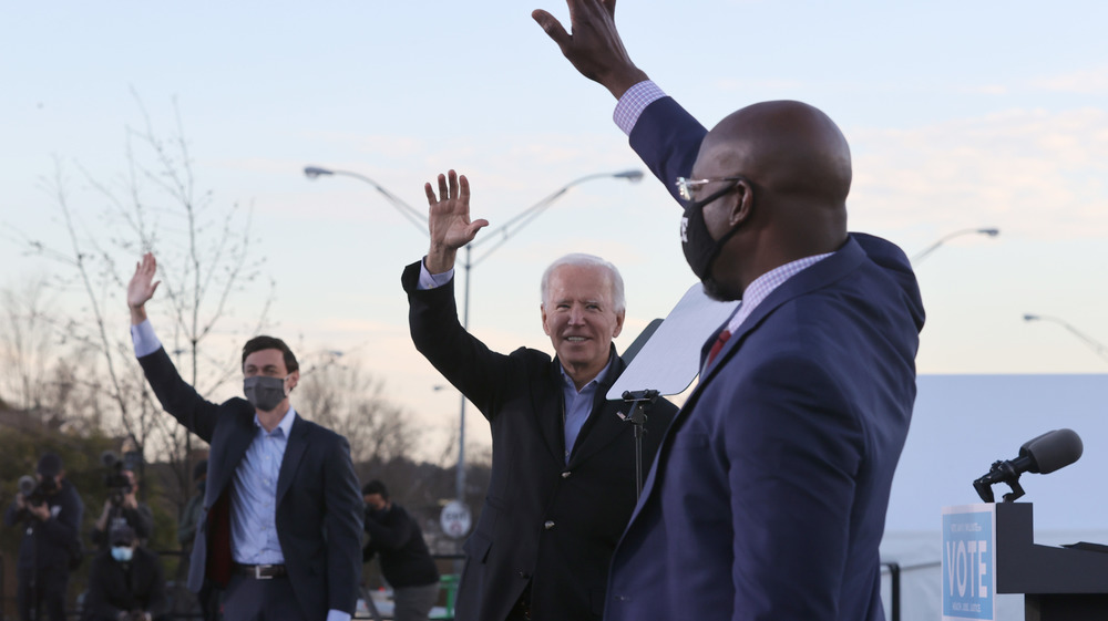 Jon Ossoff, Joe Biden, and Raphael Warnock at an event