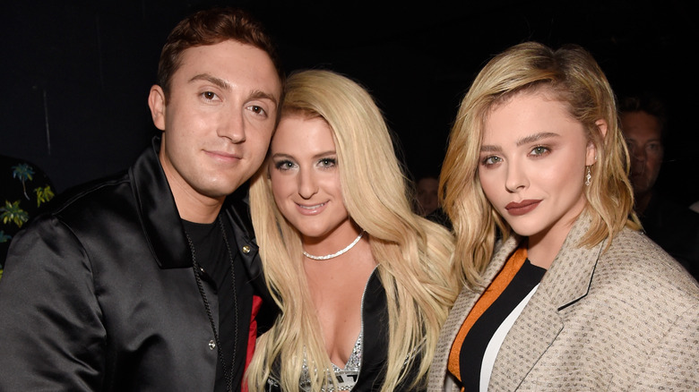 Daryl Sabara, Meghan Trainor and Chloë Grace Moretz pose at an event