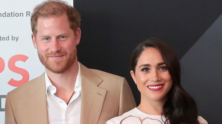 Prince Harry and Meghan Markle smiling