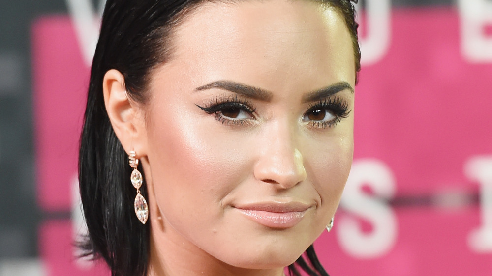 Demi Lovato smirking