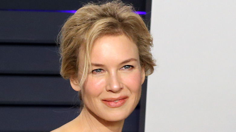 Renée Zellweger on the red carpet looking up and to the side