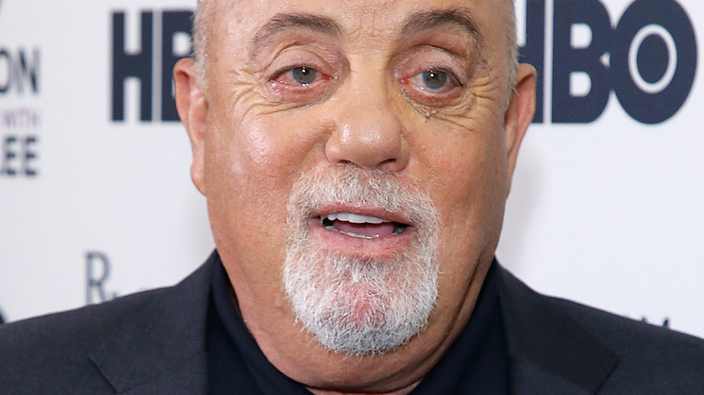 Billy Joel posing at an event in 2018