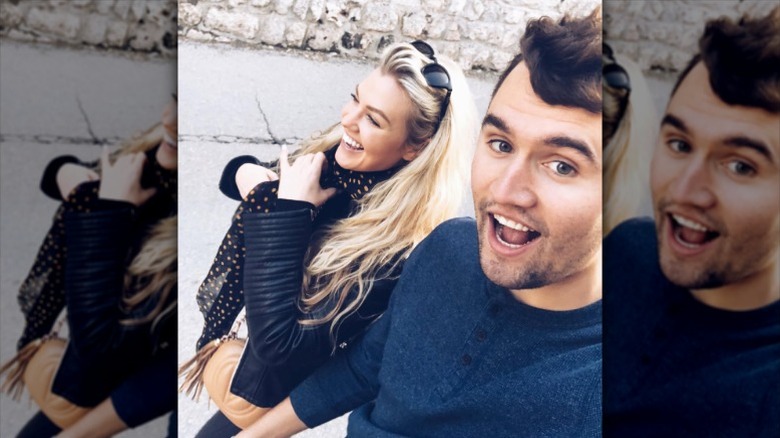 Charlie and Erika Kirk take selfie while walking and laughing
