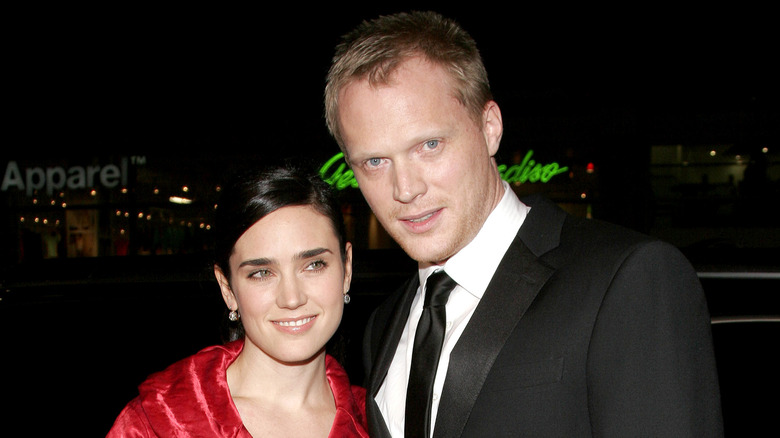 Jennifer Connelly red dress smiling Paul Bettany black suit