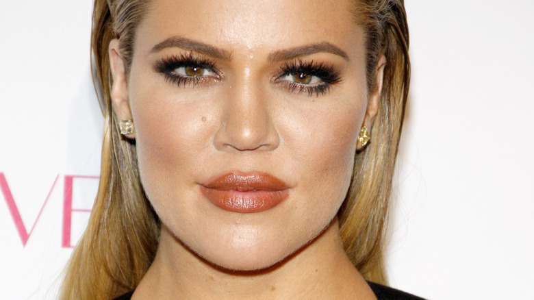 Khloe Kardashian, smirking