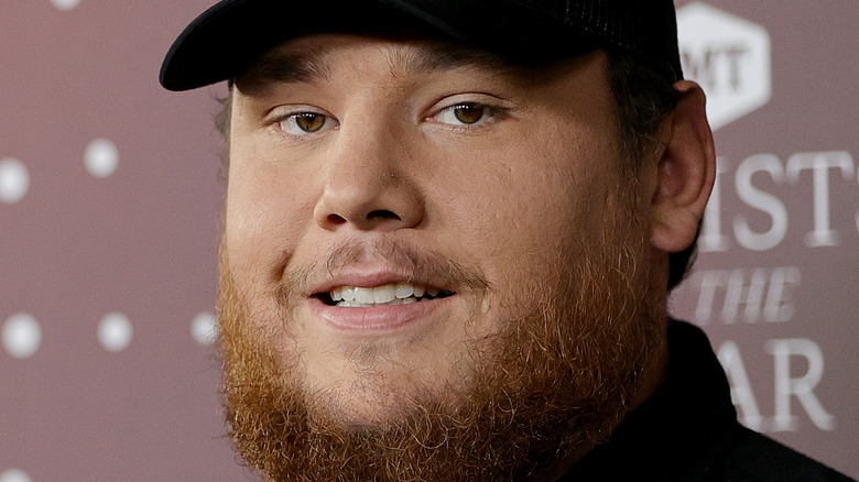 Luke Combs smiling hat