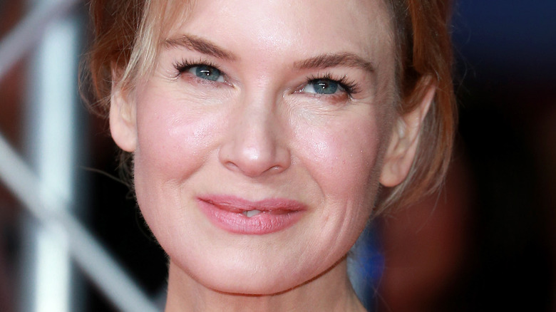Renee Zellweger smiling and looking to the side