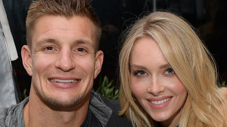 Rob Gronkowski and Camille Kostek posing for a photo