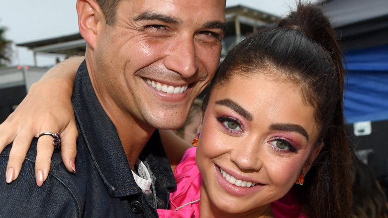 Wells Adams smiling Sarah Hyland hugging