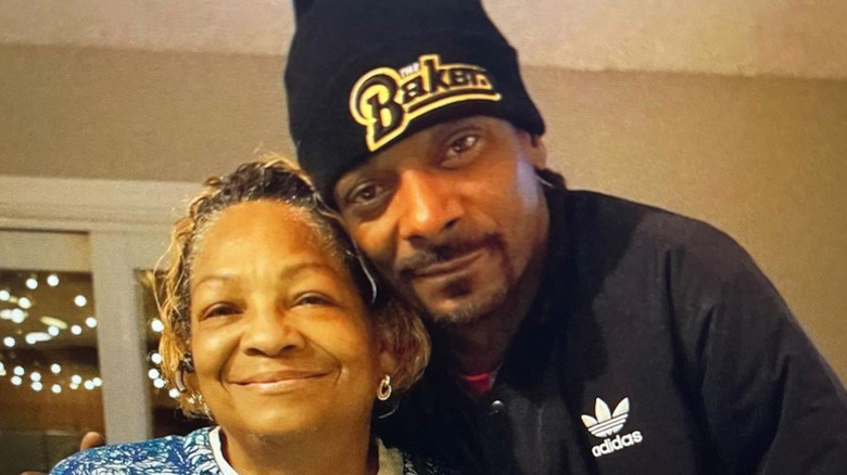 Snoop Dogg and his mom pose and smile together