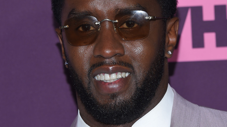 Diddy smiling on red carpet