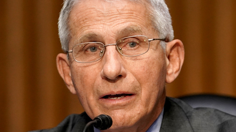 Dr. Fauci speaks at microphone