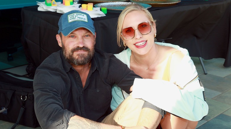 Sharna Burgess poses with Brian Austin Green in 2021