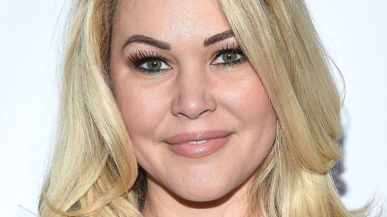 Shanna Moakler smiling with smokey eye