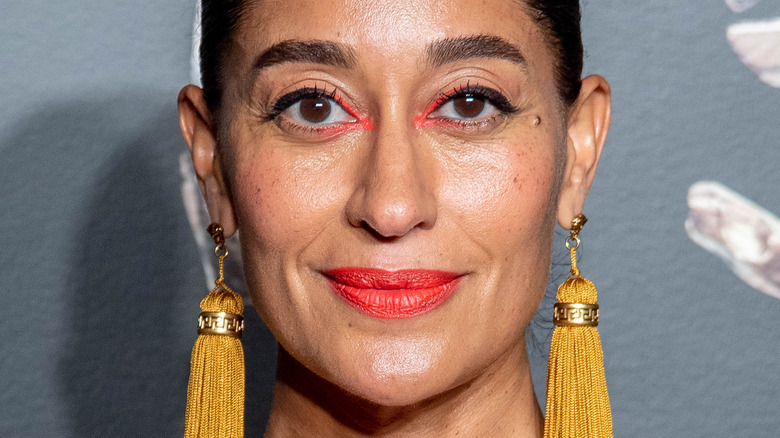 Tracee Ellis Ross wearing yellow earrings