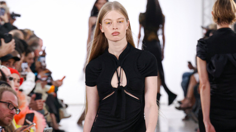 Vivian Wilson walking down a runway.