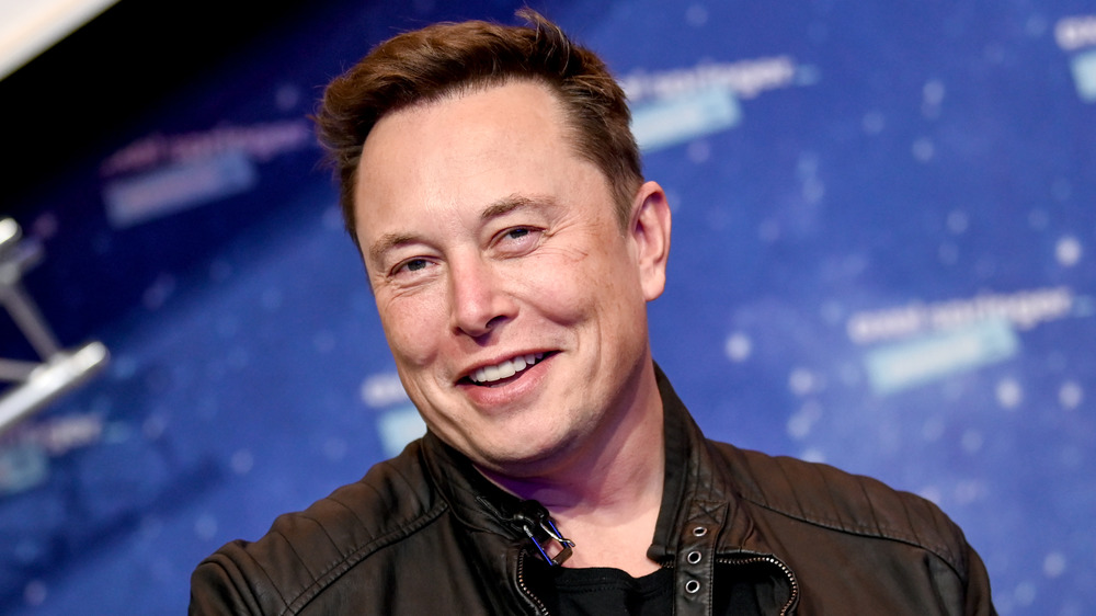 Elon Musk smiling at an event