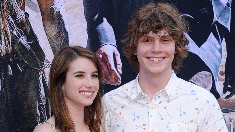 Emma Roberts smiling with Evan Peters