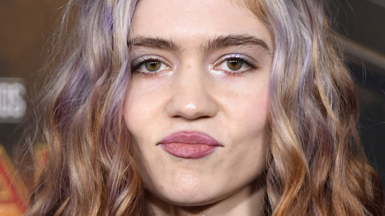 Grimes with pursed lips