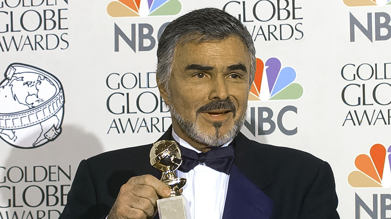 Burt Reynolds holds his Golden Globe in 1998