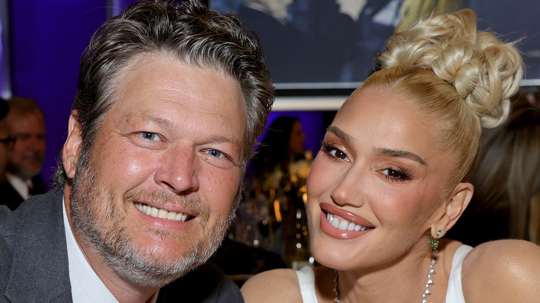 Blake Shelton smiling with Gwen Stefani