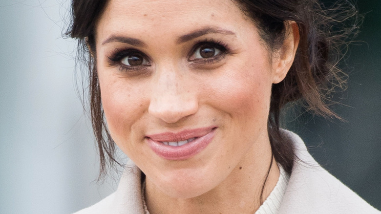 Meghan Markle smiling at camera