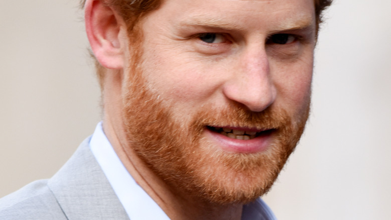 Prince Harry with slight smile looking at camera
