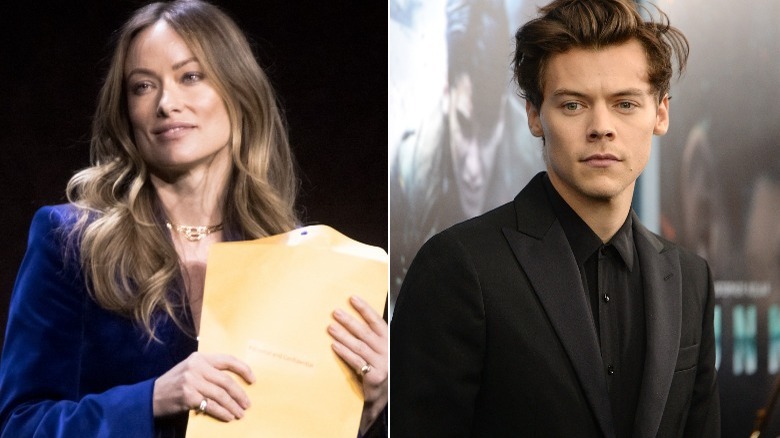 Olivia Wilde holds the legal documents on stage, Harry Styles looks on