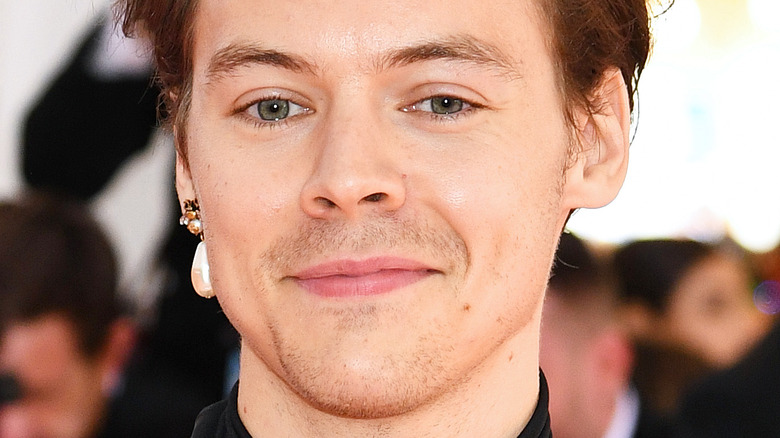 Harry Styles wears one pearl earring