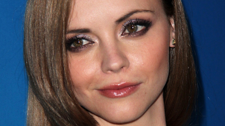 Christina Ricci poses in glittery eyeshadow and lipgloss