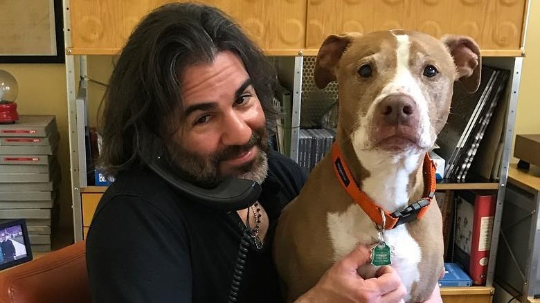 John Cusimano holding Isaboo dog