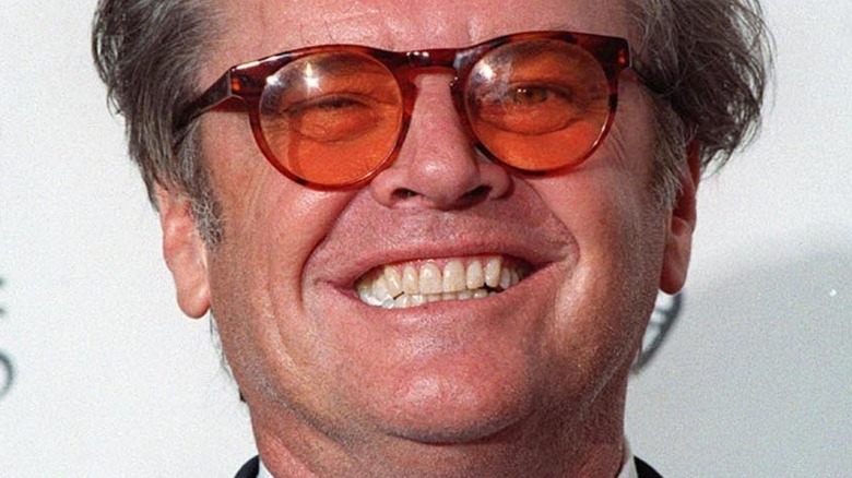 Jack Nicholson wearing red-colored glasses