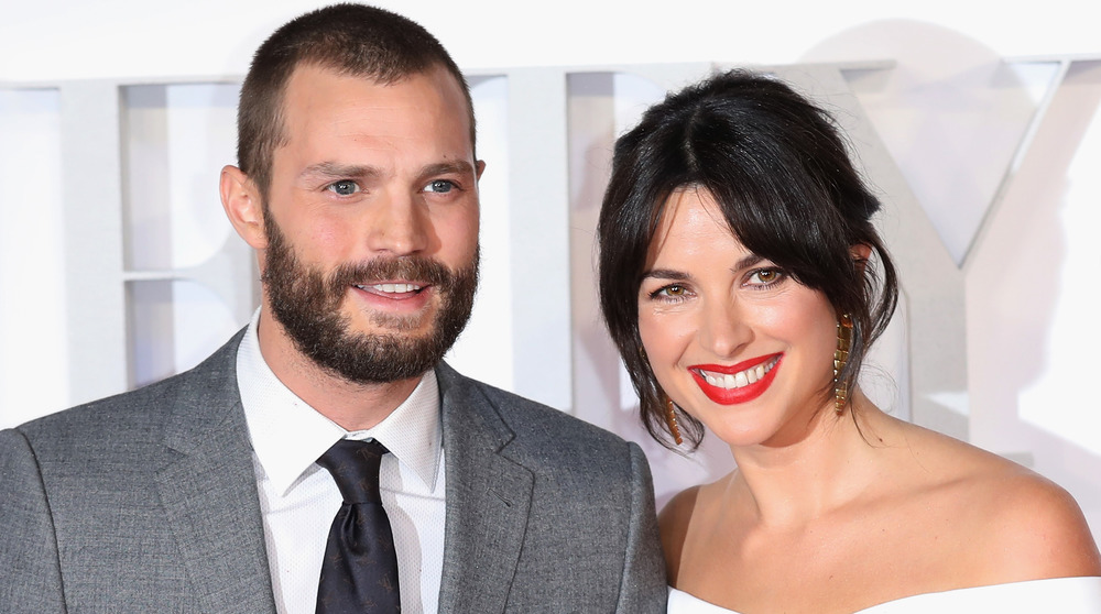 Jamie Dornan and wife Amelia Warner smiling