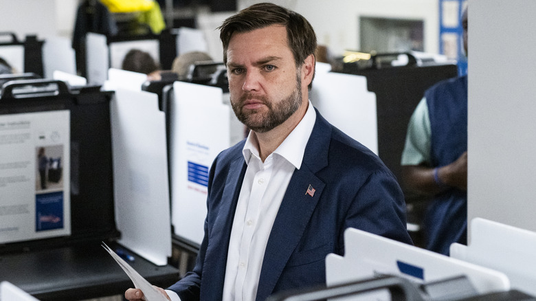 JD Vance holding papers