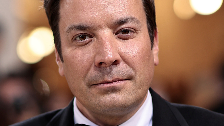 Jimmy fallon poses in a tux