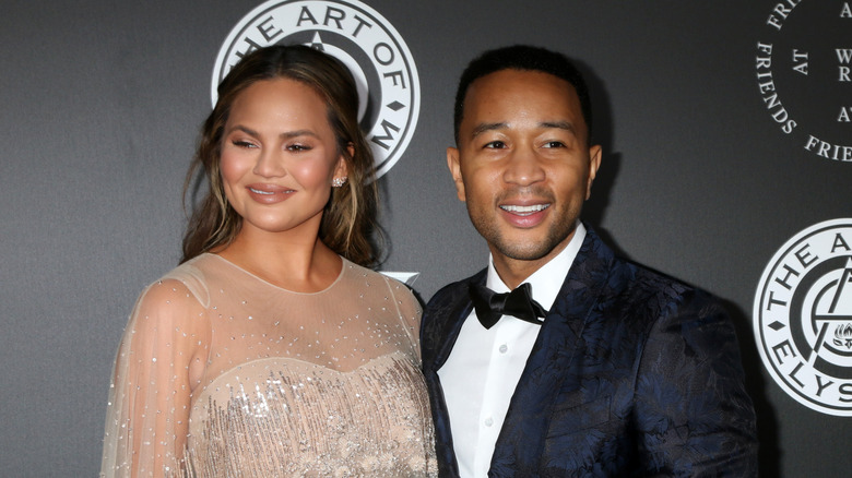 John Legend and Chrissy Teigen smile