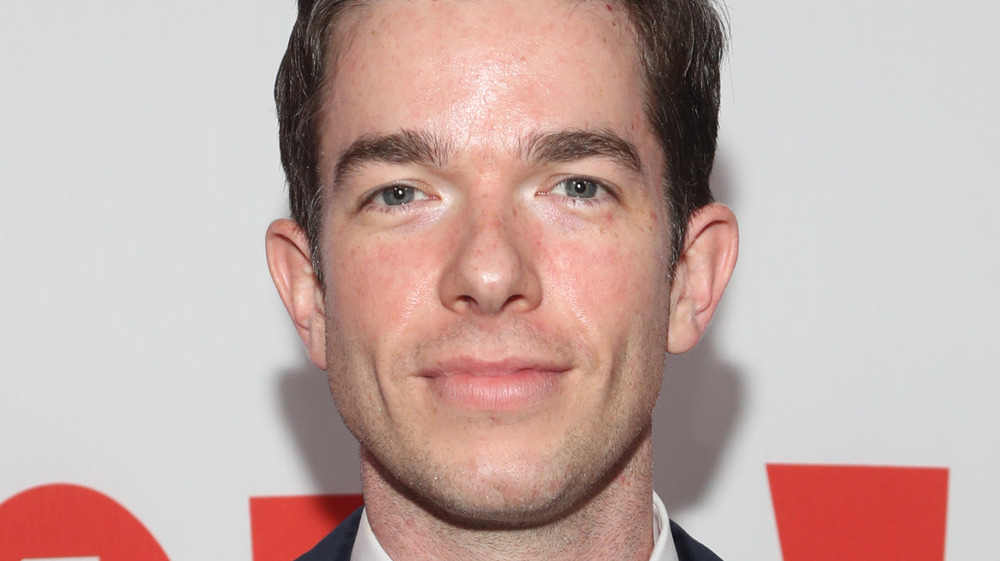 John Mulaney posing