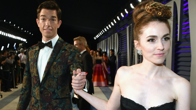 Anne Marie Tendler holding John Mulaney's hand