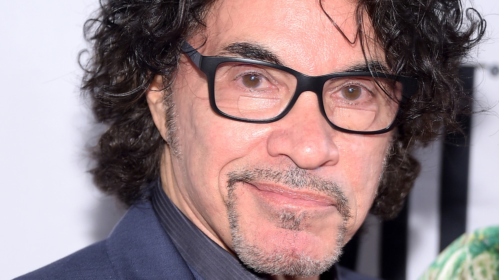 John Oates smirking