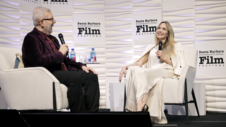 Leonard Maltin and Angelina Jolie speaking onstage at the Maltin Modern Master Award ceremony during the 40th Santa Barbara International Film Festival at Arlington Theatre