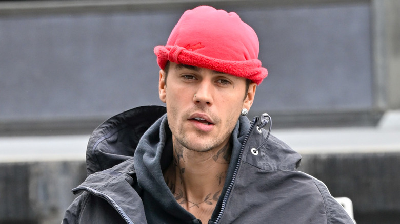 Justin Bieber wearing a red hat