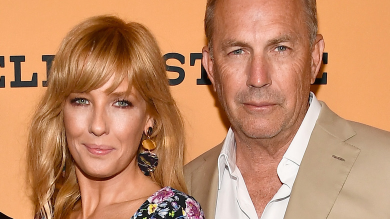 Kelly Reilly and Kevin Costner posing