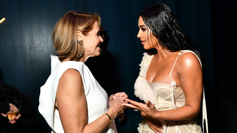 Kim Kardashian and Katie Couric embracing