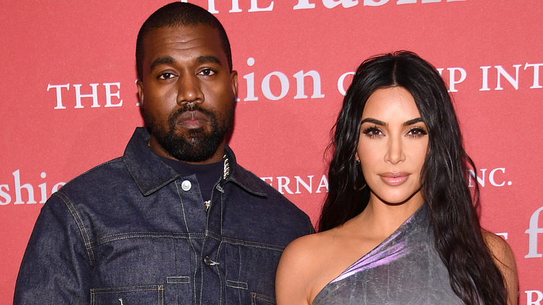 Kanye West and Kim Kardashian posing