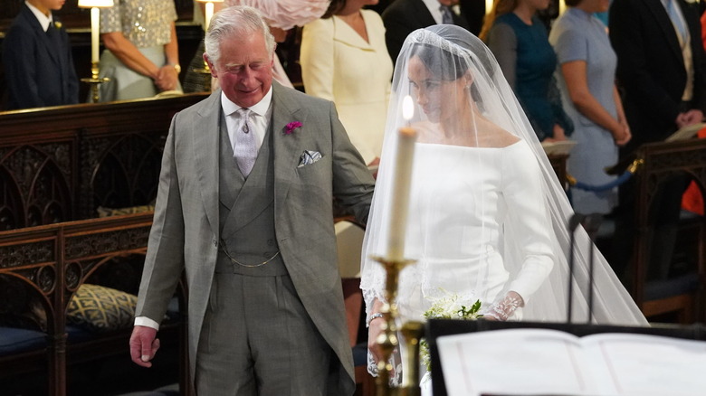 King Charles and Meghan Markle walking down the aisle