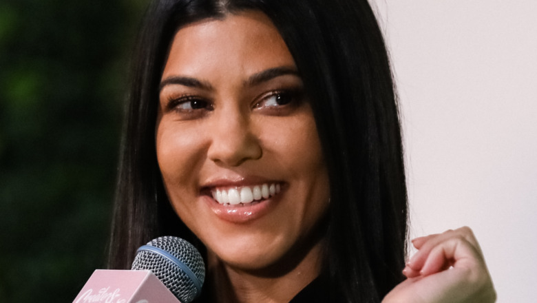 Kourtney Kardashian smiling at an event