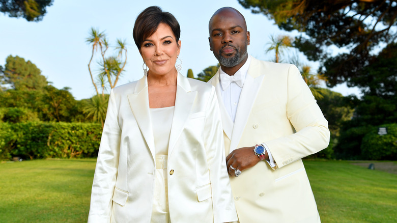 Kris Jenner and Corey Gamble wearing white